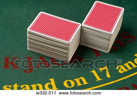 Stock Image - Stacked playing cards in a casino. Fotosearch