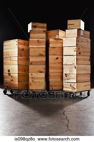Picture - Stacked wooden crates on castors. Fotosearch