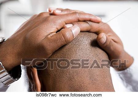 Stressed man with head in hands View Large Photo Image Stock Image - Stressed man with head in hands. Fotosearch