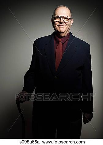 Stock Image - Studio portrait of cheerful senior man. Fotosearch