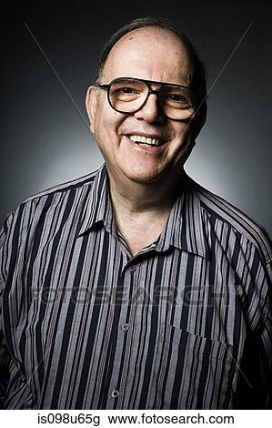 Studio portrait of cheerful senior man View Large Photo Image Stock Image - Studio portrait of cheerful senior man. Fotosearch