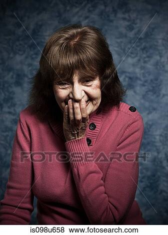 Studio portrait of cheerful senior woman View Large Photo Image Stock Photo - Studio portrait of cheerful senior woman. Fotosearch