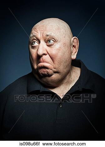 Stock Image - Studio portrait of sad senior man. Fotosearch