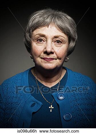 Stock Image - Studio portrait of senior woman. Fotosearch