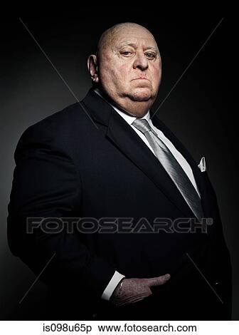 Studio portrait of serious gangster View Large Photo Image Stock Photography - Studio portrait of serious gangster. Fotosearch