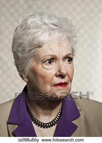 Stock Photo - Studio portrait of worried senior woman. Fotosearch