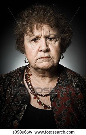 Stuido portrait of angry senior woman View Large Photo Image Stock Photo - Stuido portrait of angry senior woman. Fotosearch