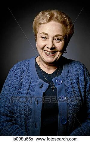Stock Photo - Stuido portrait of cheerful senior woman. Fotosearch
