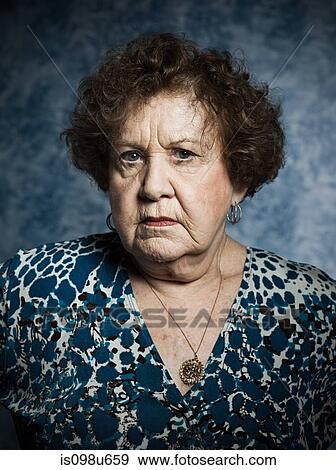Stuido portrait of serious senior woman View Large Photo Image Stock Photo - Stuido portrait of serious senior woman. Fotosearch