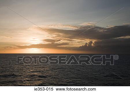 Sunset over the ocean View Large Photo Image Stock Photography - Sunset over the ocean. Fotosearch