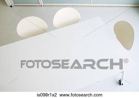 Table and chairs in an office View Large Photo Image Stock Image - Table and chairs in an office. Fotosearch