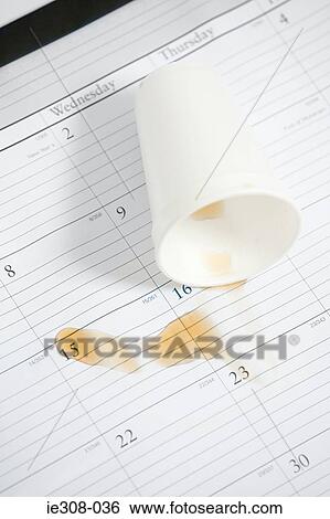 Tea spilt on a calendar View Large Photo Image Stock Photograph - Tea spilt on a calendar. Fotosearch
