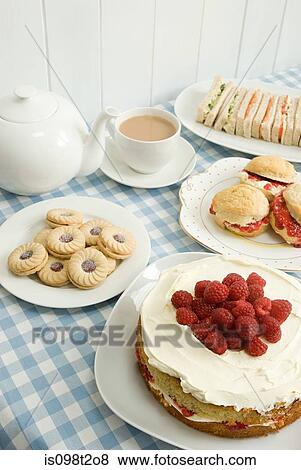 Tea with biscuits and cakes View Large Photo Image Stock Photo - Tea with biscuits and cakes. Fotosearch