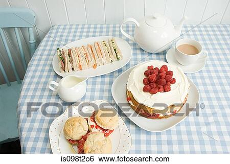 Tea with sandwiches and cakes View Large Photo Image Stock Photograph - Tea with sandwiches and cakes. Fotosearch
