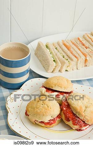 Tea with scones and sandwiches View Large Photo Image Stock Photo - Tea with scones and sandwiches. Fotosearch