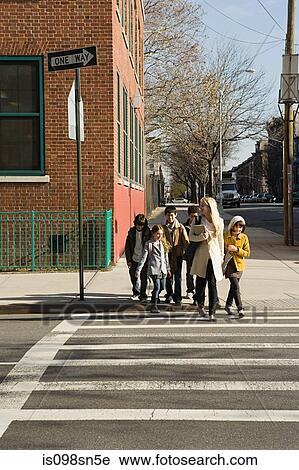 Teacher and pupils crossing road View Large Photo Image Stock Image - Teacher and pupils crossing road. Fotosearch