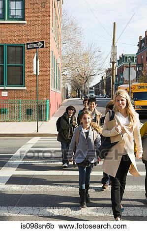 Teacher and pupils crossing road View Large Photo Image Stock Image - Teacher and pupils crossing road. Fotosearch