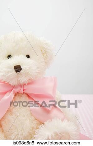 Stock Photography - Teddy bear with a bow. Fotosearch