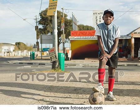 Teenage african boy with football View Large Photo Image Stock Image - Teenage african boy with football. Fotosearch