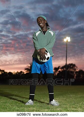 Teenage african boy with football View Large Photo Image Stock Image - Teenage african boy with football. Fotosearch