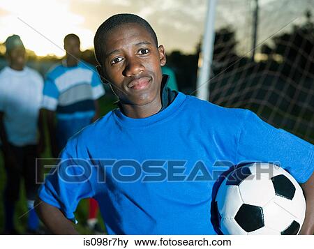 Teenage african boy with football View Large Photo Image Stock Photo - Teenage african boy with football. Fotosearch
