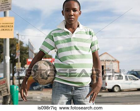 Teenage african boy with football View Large Photo Image Stock Photography - Teenage african boy with football. Fotosearch