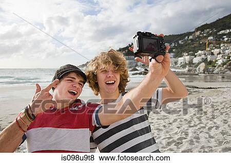 Teenage boys photographing themselves View Large Photo Image Stock Photo - Teenage boys photographing themselves. Fotosearch