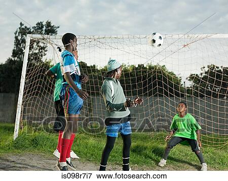 Teenage boys playing football View Large Photo Image Stock Photo - Teenage boys playing football. Fotosearch