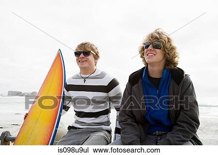 Teenage boys with surfboard View Large Photo Image Stock Image - Teenage boys with surfboard. Fotosearch