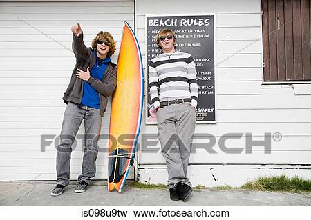 Teenage boys with surfboard View Large Photo Image Stock Photo - Teenage boys with surfboard. Fotosearch