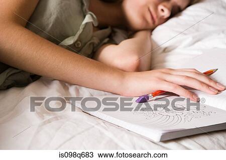 Stock Image - Teenage girl with diary. Fotosearch