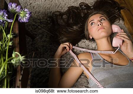Stock Photograph - Teenage girl with telephone. Fotosearch