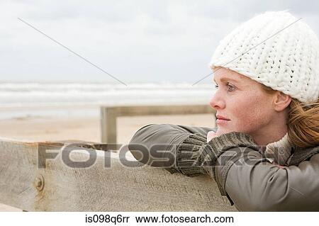 Thoughtful woman by the sea View Large Photo Image Stock Photography - Thoughtful woman by the sea. Fotosearch