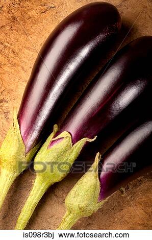 Three Aubergine on textured background View Large Photo Image Stock Image - Three Aubergine on textured background. Fotosearch