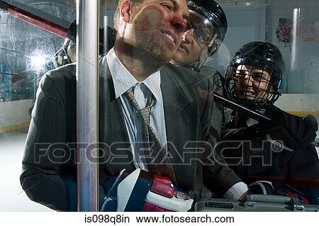 Three businessmen playing ice hockey View Large Photo Image Picture - Three businessmen playing ice hockey. Fotosearch