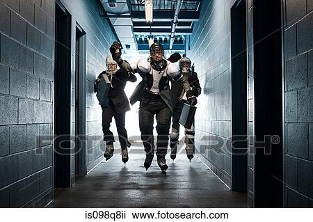 Three businessmen wearing ice hockey uniforms View Large Photo Image Stock Image - Three businessmen wearing ice hockey uniforms. Fotosearch