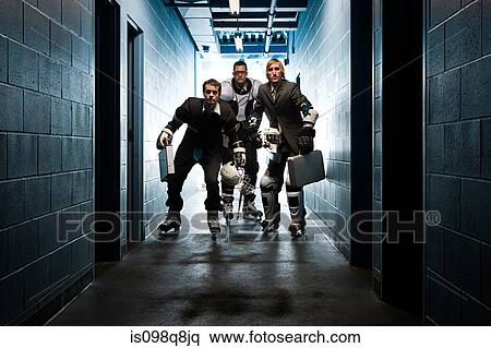 Three businessmen wearing ice hockey uniforms View Large Photo Image Stock Photography - Three businessmen wearing ice hockey uniforms. Fotosearch