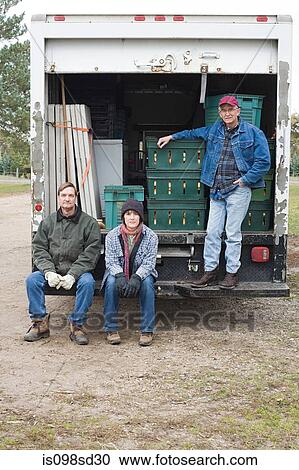 Three farmers by truck View Large Photo Image Stock Image - Three farmers by truck. Fotosearch