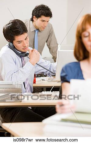 Three young office workers View Large Photo Image Stock Photography - Three young office workers. Fotosearch