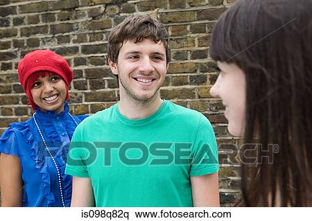 Stock Photography - Three young people. Fotosearch