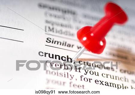 Stock Image - Thumb tack on word crunch. Fotosearch
