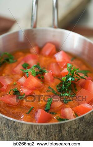Tomato in a saucepan View Large Photo Image Stock Image - Tomato in a saucepan. Fotosearch