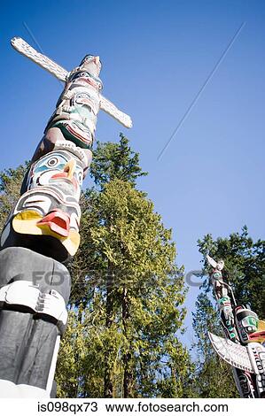 Totem poles in stanley park vancouver View Large Photo Image Stock Image - Totem poles in stanley park vancouver. Fotosearch