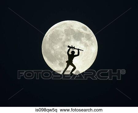 Stock Photography - Toy soldier against full moon. Fotosearch