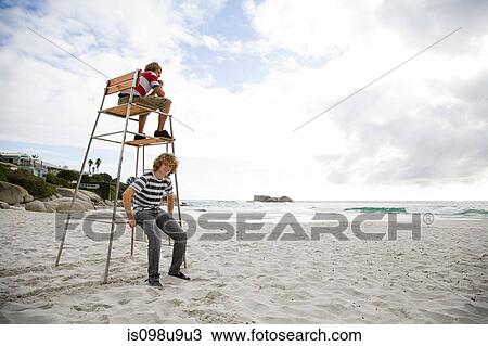 Two boys on lifeguard tower View Large Photo Image Stock Image - Two boys on lifeguard tower. Fotosearch