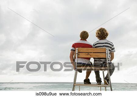 Two boys on lifeguard tower View Large Photo Image Stock Image - Two boys on lifeguard tower. Fotosearch