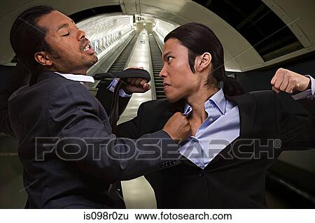 Two businessmen fighting View Large Photo Image Stock Photograph - Two businessmen fighting. Fotosearch