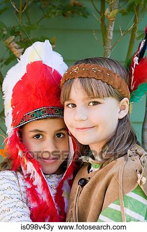 Stock Photo - Two girls in Native American costumes. Fotosearch