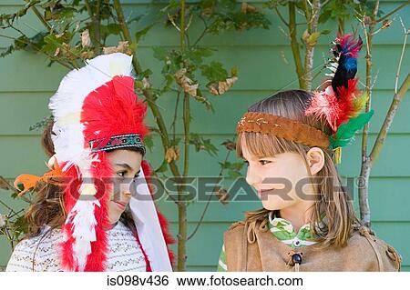 Stock Photograph - Two girls in Native American costumes. Fotosearch
