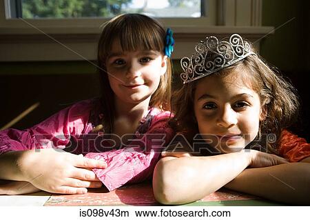 Two girls, one wearing tiara View Large Photo Image Picture - Two girls, one wearing tiara. Fotosearch